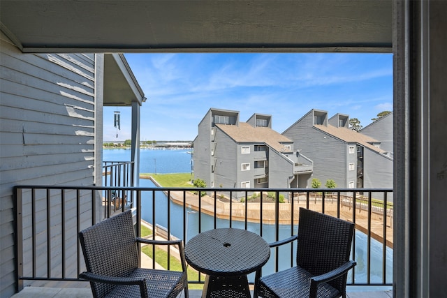 balcony featuring a water view