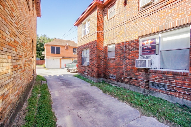 view of home's exterior featuring an outdoor structure and a garage