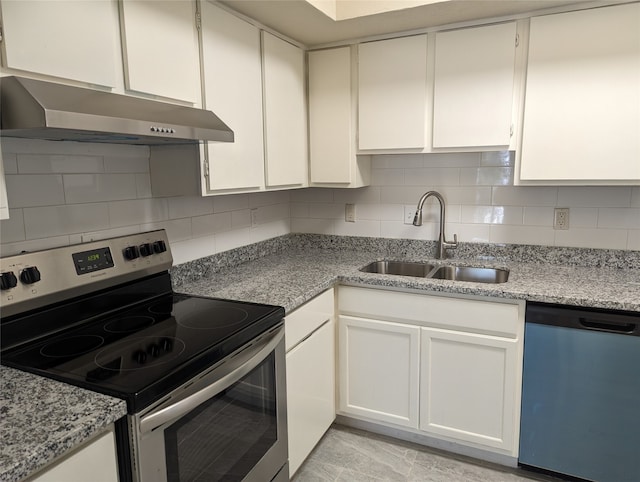 kitchen featuring light stone countertops, sink, backsplash, stainless steel appliances, and white cabinets