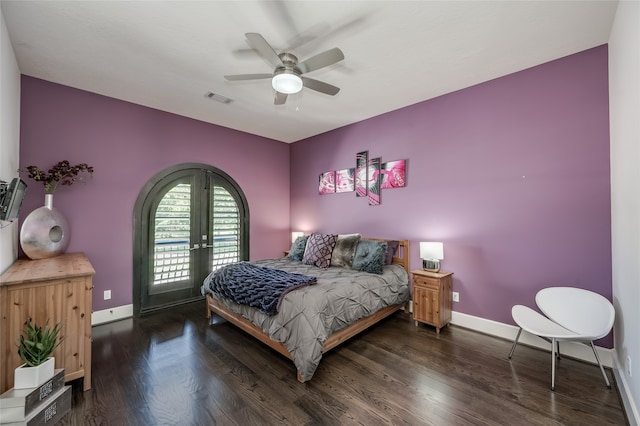 bedroom with french doors, dark hardwood / wood-style flooring, and ceiling fan