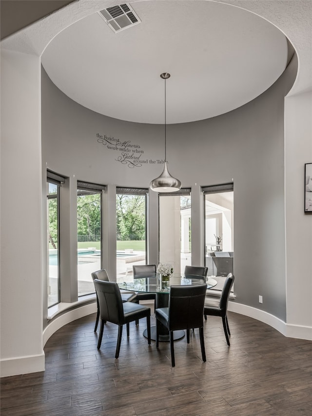 dining area featuring dark hardwood / wood-style floors