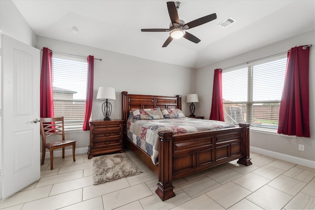 tiled bedroom featuring ceiling fan and vaulted ceiling