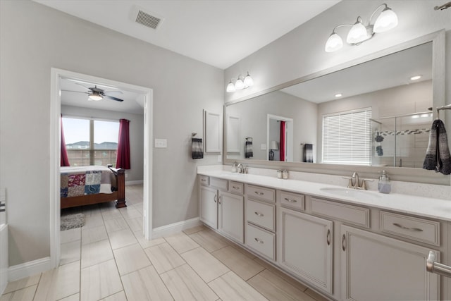 bathroom with vanity, tile patterned floors, a shower with shower door, and ceiling fan