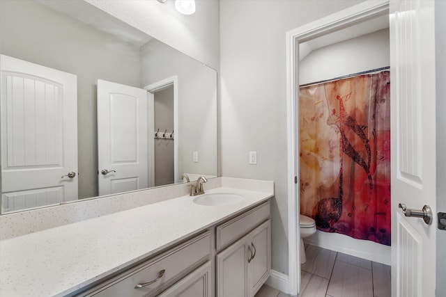 bathroom featuring vanity, toilet, and a shower with curtain