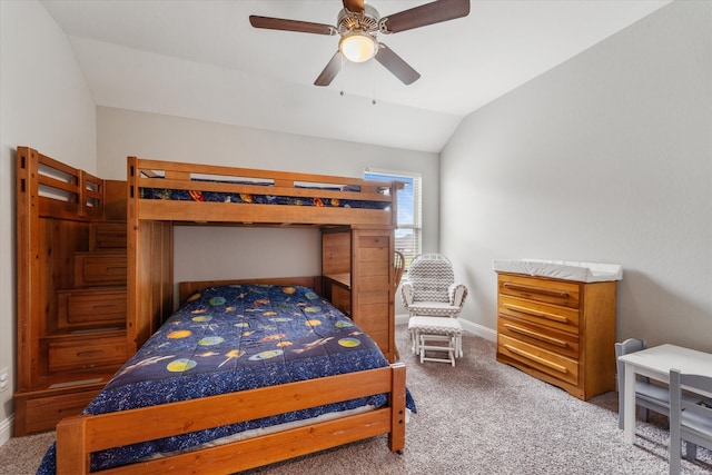 carpeted bedroom featuring vaulted ceiling and ceiling fan