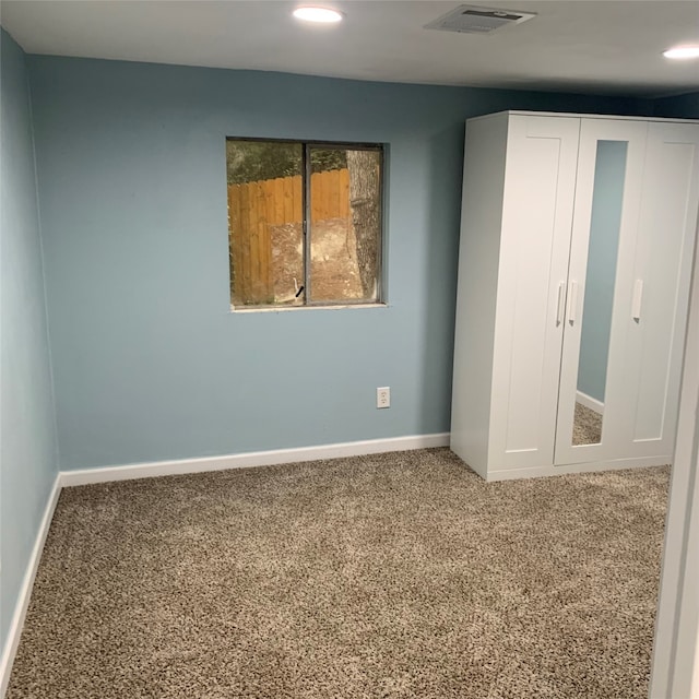 unfurnished bedroom with carpet floors