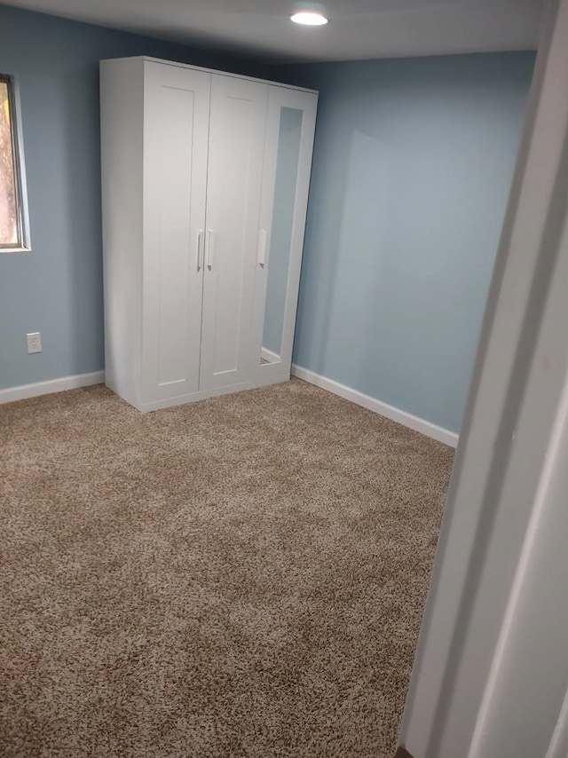 unfurnished bedroom with carpet flooring