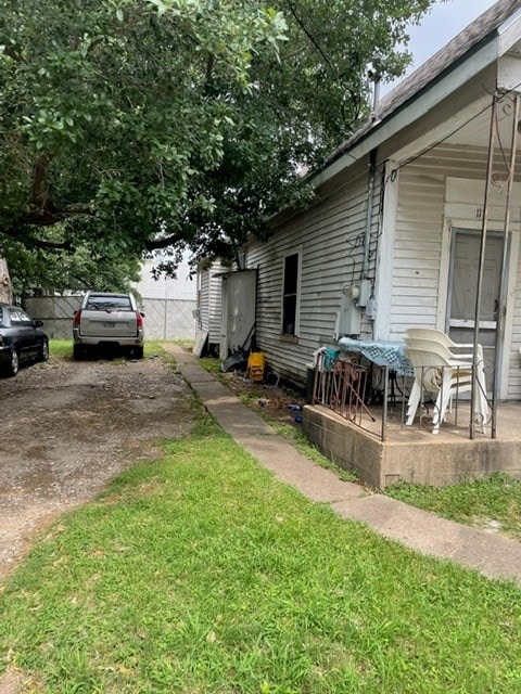 view of property exterior with a yard