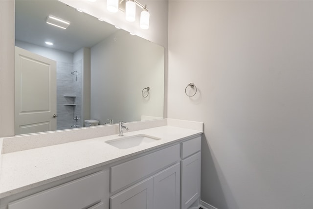 bathroom with toilet and vanity