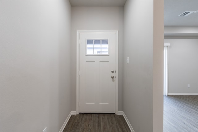 doorway with dark wood-type flooring