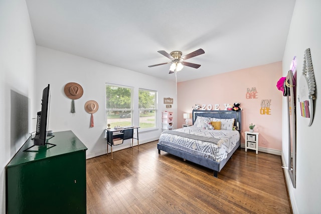 bedroom with dark wood-type flooring and ceiling fan