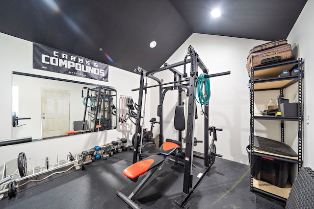 workout room with vaulted ceiling