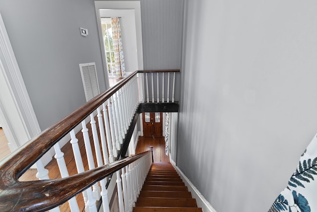 stairway featuring wood-type flooring