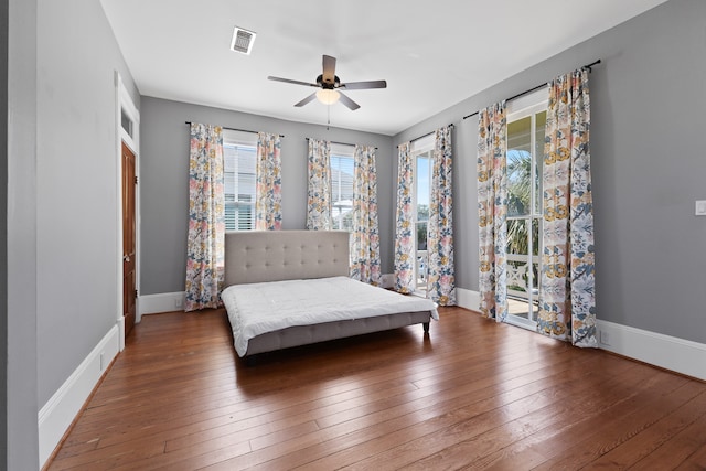 unfurnished bedroom with dark wood-type flooring and ceiling fan