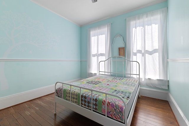 bedroom with wood-type flooring and lofted ceiling