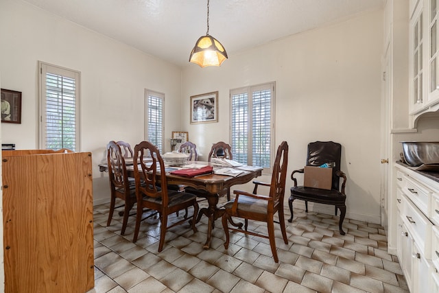 dining room with plenty of natural light and light tile flooring