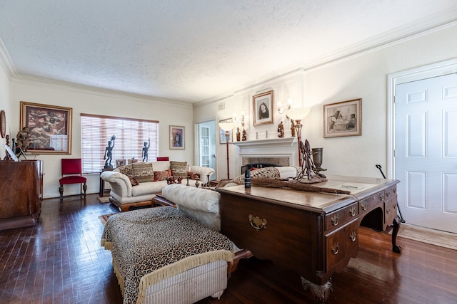 living room featuring ornamental molding, dark hardwood / wood-style flooring, a fireplace, and a textured ceiling