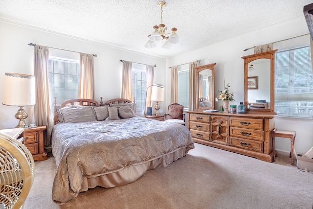 carpeted bedroom with a notable chandelier, multiple windows, and a textured ceiling