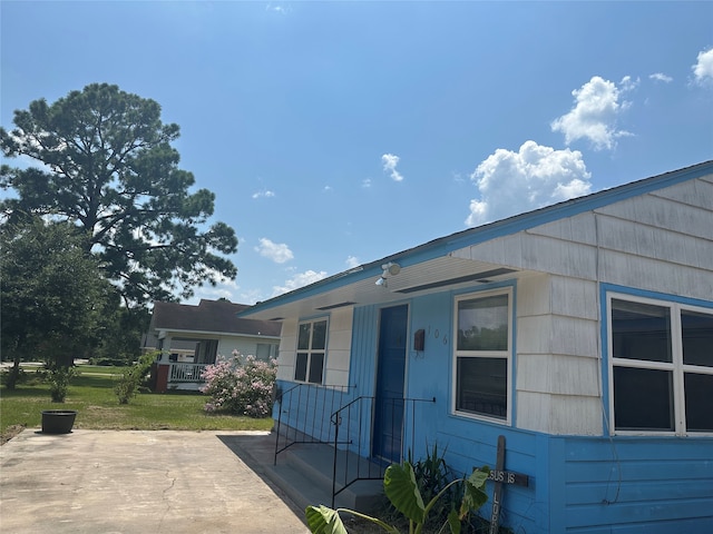 view of property exterior featuring a yard