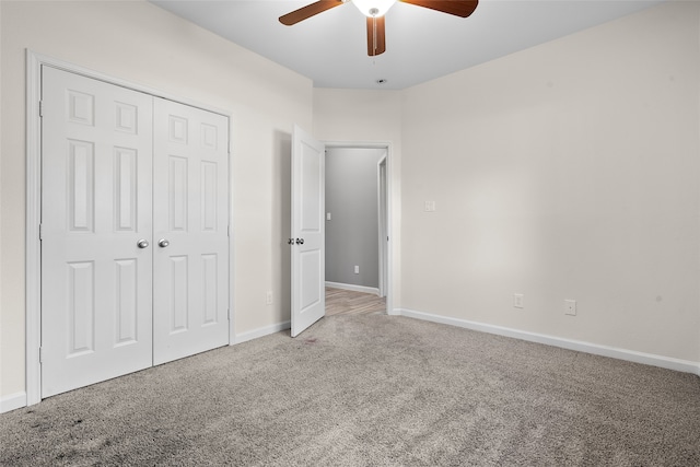 unfurnished bedroom featuring a closet, ceiling fan, and carpet flooring