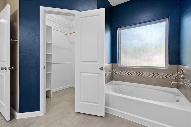 bathroom featuring a tub to relax in