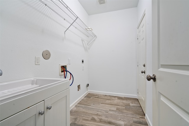 laundry room featuring light hardwood / wood-style floors, electric dryer hookup, hookup for a washing machine, cabinets, and sink