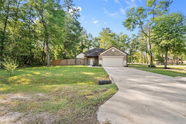 ranch-style home featuring a front yard and a garage