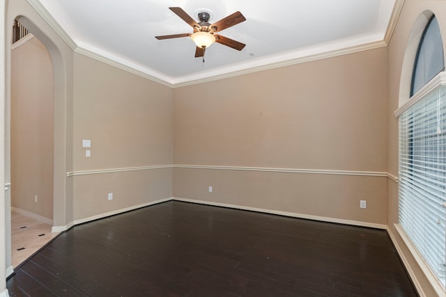 unfurnished room featuring hardwood / wood-style floors, ceiling fan, and crown molding