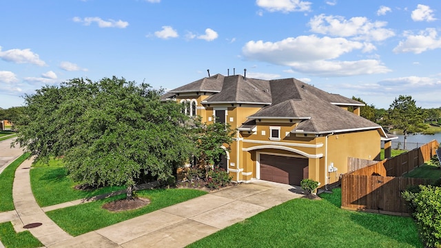 view of front facade with a garage and a front yard