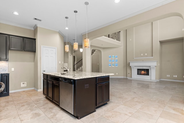 kitchen with pendant lighting, light stone countertops, dark brown cabinets, stainless steel dishwasher, and light tile floors