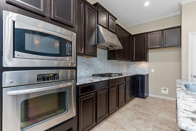 kitchen with light stone counters, tasteful backsplash, stainless steel appliances, and crown molding