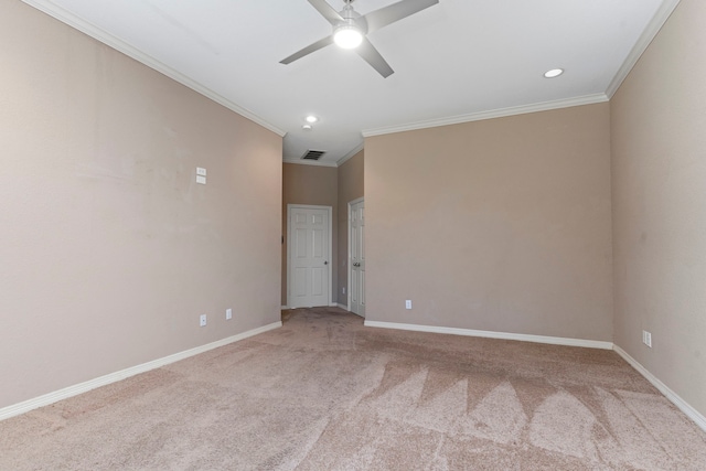 carpeted empty room with ornamental molding and ceiling fan