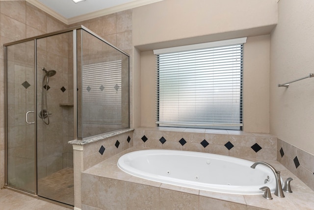 bathroom with crown molding and separate shower and tub