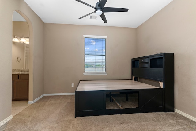 office with carpet, ceiling fan, and sink