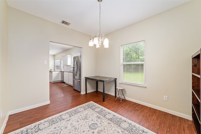 interior space featuring a chandelier and hardwood / wood-style flooring