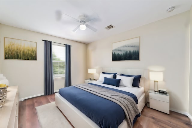 bedroom featuring ceiling fan and dark wood-type flooring