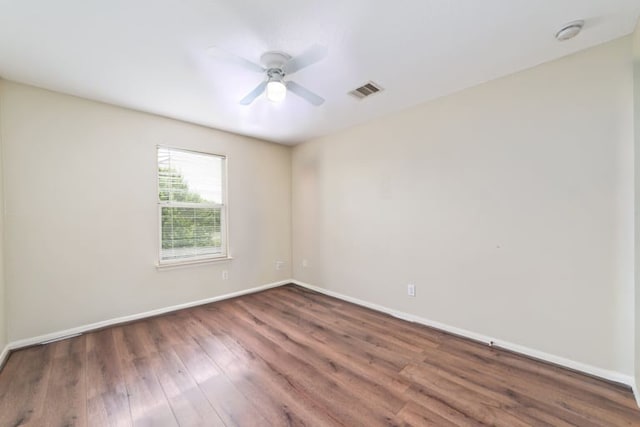 empty room with hardwood / wood-style flooring and ceiling fan