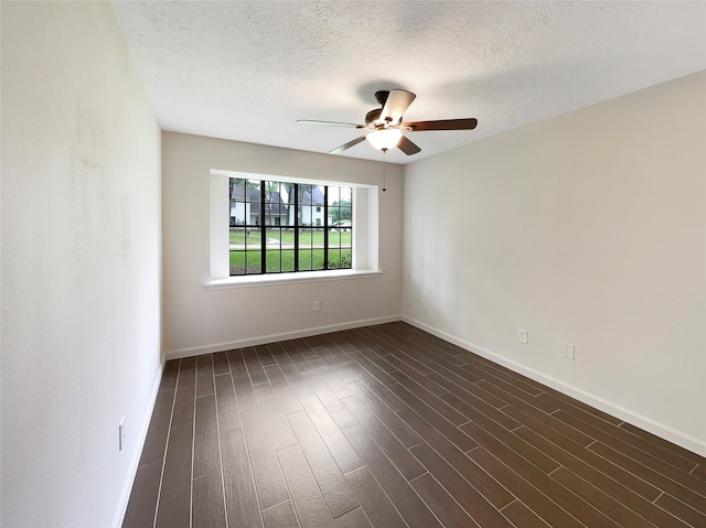 empty room with hardwood / wood-style flooring, ceiling fan, and a textured ceiling