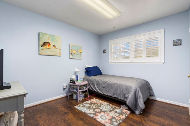 bedroom featuring dark hardwood / wood-style floors