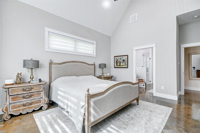 bedroom with high vaulted ceiling and concrete floors