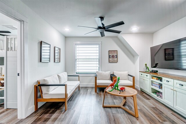 sitting room featuring ceiling fan and light wood-type flooring