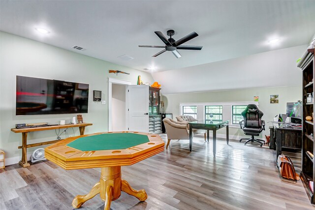 recreation room with light hardwood / wood-style flooring, ceiling fan, and lofted ceiling