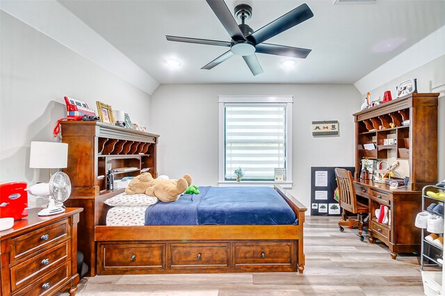 bedroom with light hardwood / wood-style flooring and ceiling fan