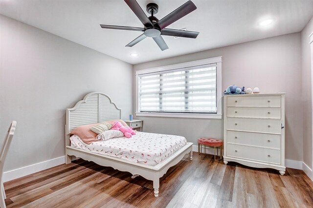 bedroom featuring ceiling fan and hardwood / wood-style floors