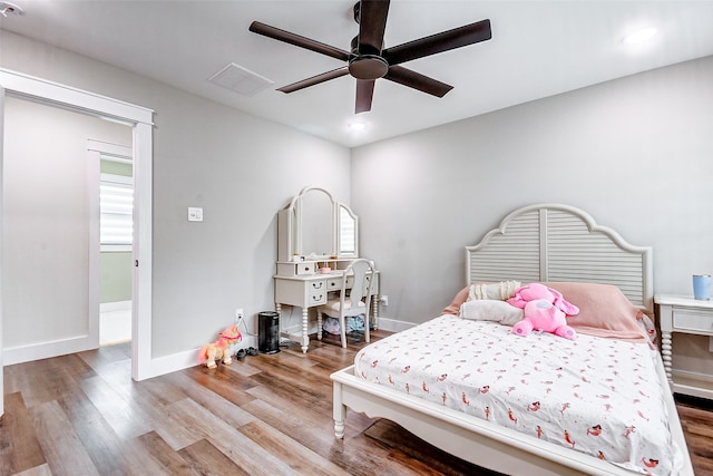 bedroom featuring wood-type flooring and ceiling fan