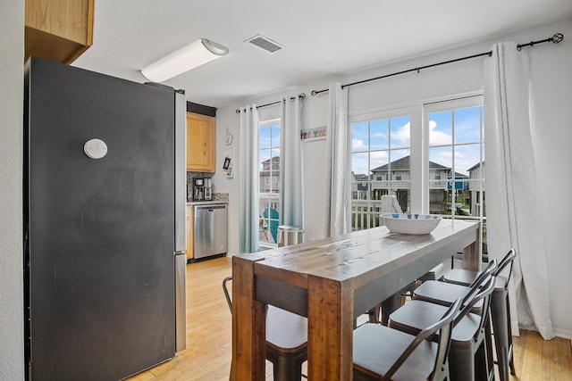 dining room with light hardwood / wood-style floors