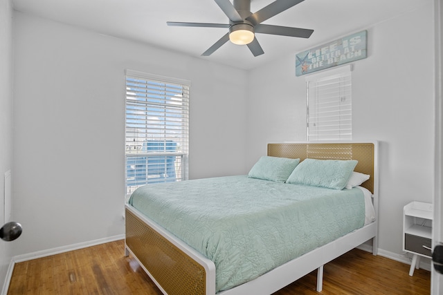 bedroom with hardwood / wood-style floors and ceiling fan