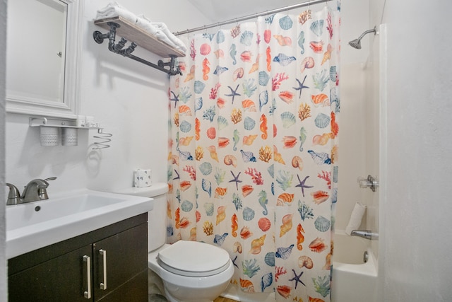 full bathroom with vanity, shower / tub combo, and toilet