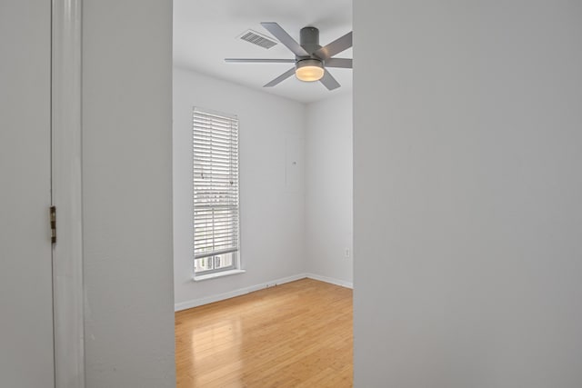 unfurnished room featuring light hardwood / wood-style flooring, a wealth of natural light, and ceiling fan