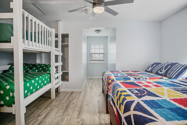 bedroom with ceiling fan and hardwood / wood-style flooring